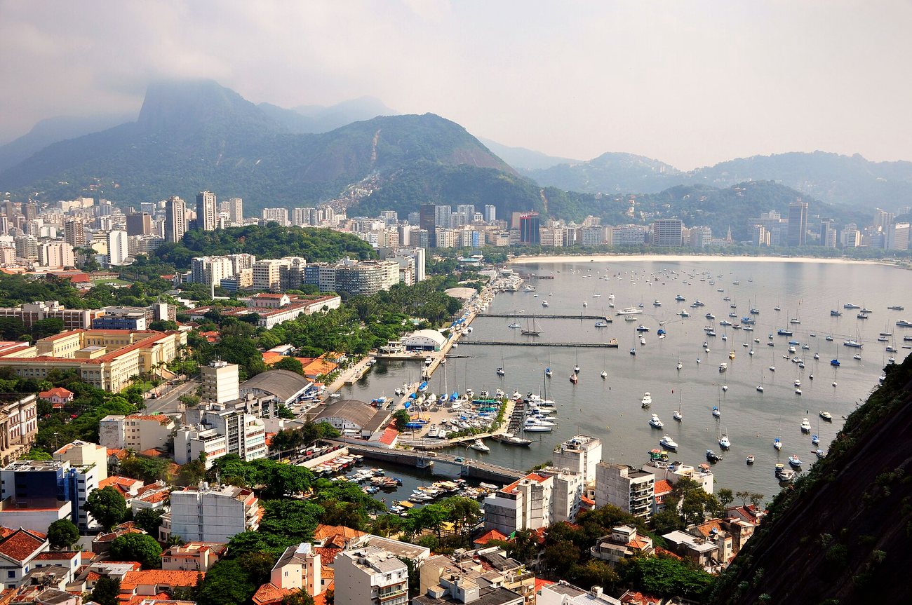View over Botafogo Bay and its marina with Flamengo and Botafogo apartment towers below Corcovado in Rio de Janeiro