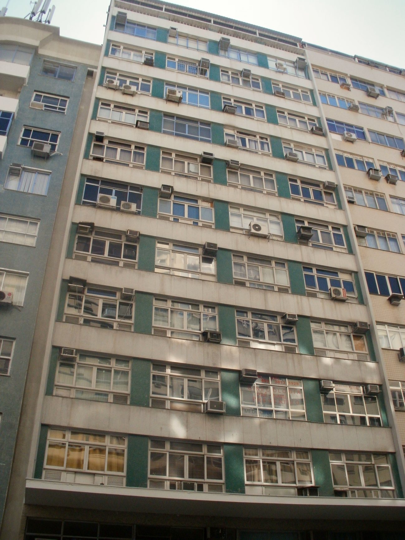 Older residential towers along a Copacabana street, typical of the mid-century stock foreign buyers renovate