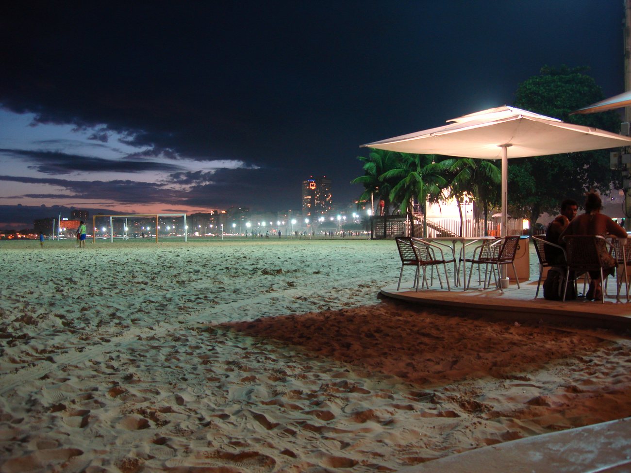 The famous wave-patterned promenade running along Copacabana beach with apartment towers behind
