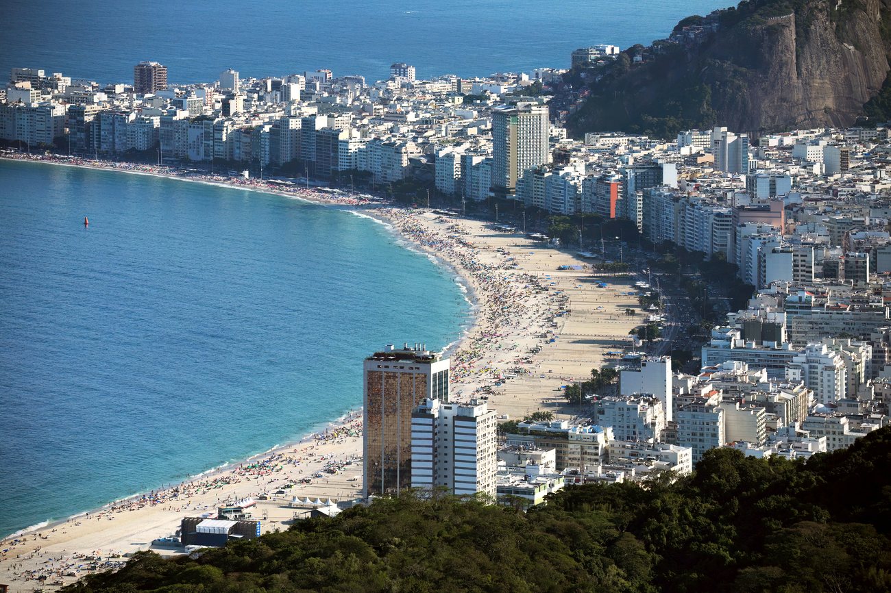 The residential buildings lining Copacabana beach behind its wave-patterned promenade